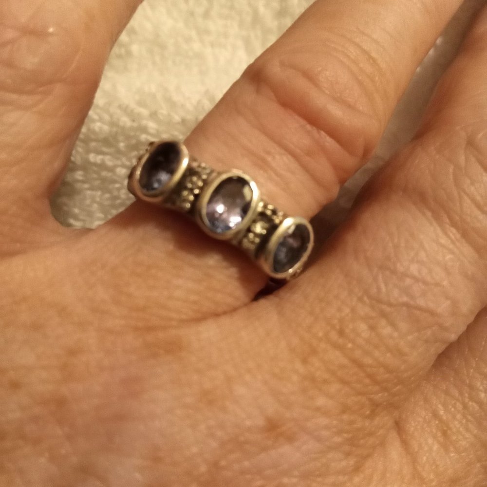 Tanzanite oval stones with diamond chips set in a sterling silver thick band 7